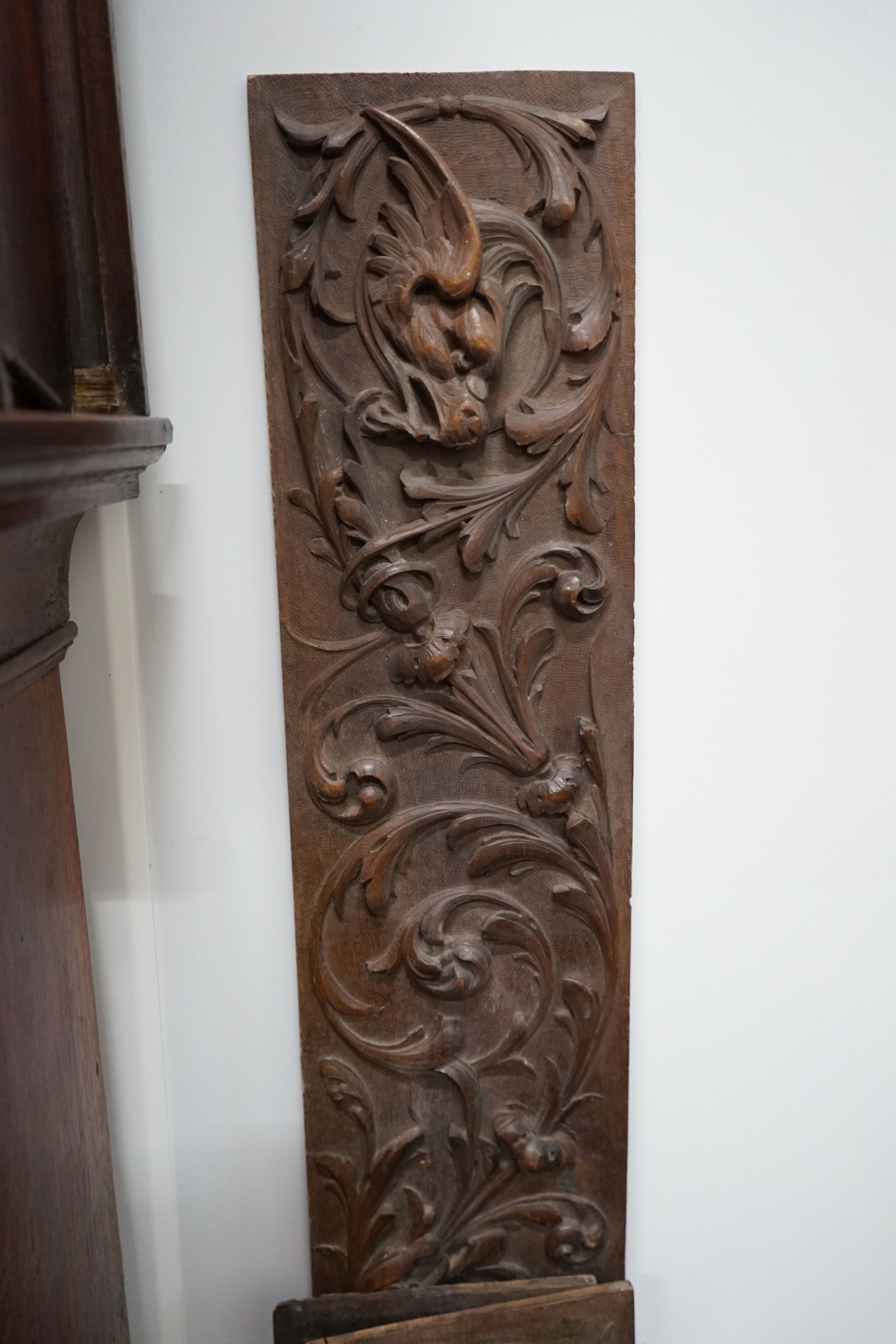 Four rectangular carved oak panels, largest length 152cm